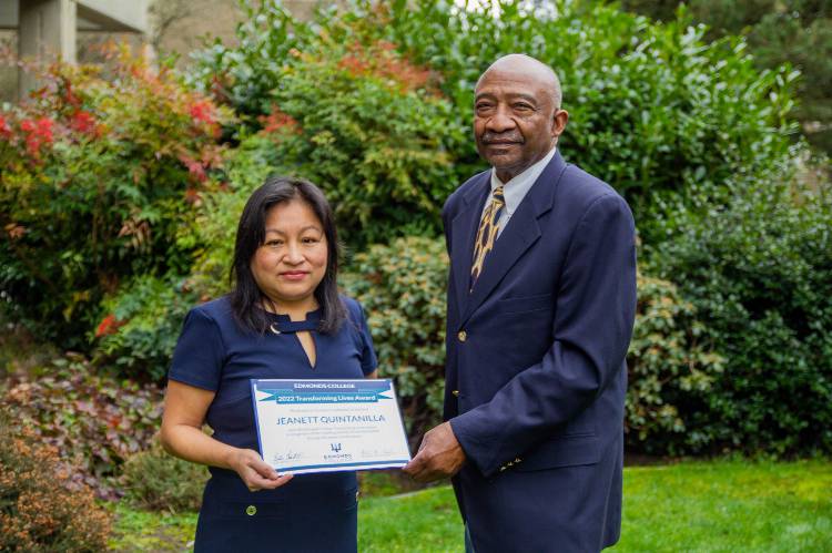 Above: Jeanett Quintanilla and EC Board Chair Wally Webster pose outside with award